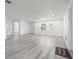 Spacious living area features new floors, paint, recessed lighting, and a welcome mat at 3139 Elkridge Dr, Holiday, FL 34691