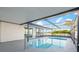 Enjoy the refreshing enclosed swimming pool with metal ladder and railings at 3139 Elkridge Dr, Holiday, FL 34691