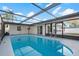 Large, enclosed in-ground pool offers plenty of space for swimming and fun at 3139 Elkridge Dr, Holiday, FL 34691