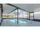 Cool off in the enclosed pool with metal ladder and railings at 3139 Elkridge Dr, Holiday, FL 34691