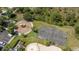 Aerial view of community amenities including a playground, basketball court, and pool with lounge chairs at 33105 Major Oak Dr, Wesley Chapel, FL 33545