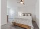 Bedroom featuring a wooden bed frame, a ceiling fan, and gray carpet at 33105 Major Oak Dr, Wesley Chapel, FL 33545