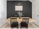 Comfortable dining area with a wooden table and modern chairs, perfect for Gathering meals at 33105 Major Oak Dr, Wesley Chapel, FL 33545