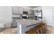 Charming kitchen features granite countertops, stainless steel appliances, and gray cabinets at 33105 Major Oak Dr, Wesley Chapel, FL 33545