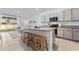 Open concept kitchen with granite countertops, bar stool seating, and stainless appliances at 33105 Major Oak Dr, Wesley Chapel, FL 33545