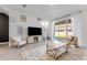 Bright living room with sliding glass doors and cozy seating arrangement at 33105 Major Oak Dr, Wesley Chapel, FL 33545
