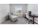 Minimalist office with a comfortable chair, desk, and a bright window view at 33105 Major Oak Dr, Wesley Chapel, FL 33545