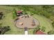 Aerial view of the community playground featuring modern play structures and a picnic area at 33105 Major Oak Dr, Wesley Chapel, FL 33545