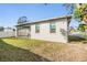 Well-maintained backyard with a covered patio, providing a serene outdoor living space at 3326 W Heiter St, Tampa, FL 33607