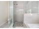 Modern bathroom featuring a glass-enclosed shower, custom tile work, and updated fixtures at 3326 W Heiter St, Tampa, FL 33607