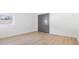 Simple bedroom has neutral walls, laminate flooring, and a double-door closet at 3326 W Heiter St, Tampa, FL 33607