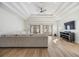 Bright living room features recessed ceilings, fan, light wood floors, and direct patio access at 3326 W Heiter St, Tampa, FL 33607
