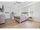 Light and airy main bedroom features laminate flooring, recessed lighting, and a ceiling fan at 3326 W Heiter St, Tampa, FL 33607
