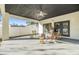 Relaxing covered patio features comfortable wicker furniture and a tranquil outdoor space at 3326 W Heiter St, Tampa, FL 33607