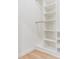 Bright walk-in closet features adjustable shelves and hanging rods for optimal storage solutions at 3326 W Heiter St, Tampa, FL 33607