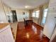 Bright dining area with hardwood floors, a classic dining table, and natural light from the window at 34461 Cactus Dr, Pinellas Park, FL 33781