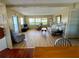 Cozy living room featuring wood floors, bright windows, and comfortable seating arrangements at 34461 Cactus Dr, Pinellas Park, FL 33781