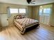 Cozy bedroom with a ceiling fan, closet, and built-in drawers at 34461 Cactus Dr, Pinellas Park, FL 33781