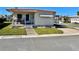 Charming single-story home with a cozy front porch and well-maintained lawn at 34461 Cactus Dr, Pinellas Park, FL 33781