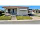 Charming single-story home with well-maintained lawn, corner lot, and covered porch at 34461 Cactus Dr, Pinellas Park, FL 33781