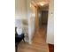 Long hallway with laminate flooring and a neutral color scheme at 34461 Cactus Dr, Pinellas Park, FL 33781