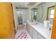 Well-lit bathroom featuring a vanity with a large mirror and enclosed shower at 35109 Excalibur, Webster, FL 33597