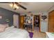 Comfortable bedroom with a ceiling fan, vanity, and walk-in closet at 35109 Excalibur, Webster, FL 33597