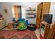 Bright bedroom with a large rug, closet, storage for books, and play area at 35109 Excalibur, Webster, FL 33597