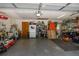 View of a two car garage with shelving, storage and lighting fixtures at 35109 Excalibur, Webster, FL 33597