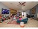 Cozy living room featuring a stone fireplace, bright natural light, and a comfortable seating area at 35109 Excalibur, Webster, FL 33597