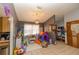 Bright living room with tile flooring and natural light, perfect for relaxation and play at 35109 Excalibur, Webster, FL 33597