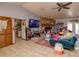 Inviting living room with tile floors, a stone fireplace, and bright natural light at 35109 Excalibur, Webster, FL 33597