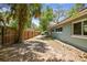 The backyard featuring a long wooden fence offers a private and spacious outdoor area at 422 Dunedin Cir, Temple Terrace, FL 33617