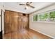 Bedroom with wood floors and a large closet at 422 Dunedin Cir, Temple Terrace, FL 33617