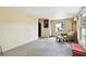 Bonus room with natural light, comfortable seating, and views of the outdoors provides additional living space at 422 Dunedin Cir, Temple Terrace, FL 33617