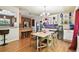 Dining room features an open floor plan with hardwood floors and a built-in bar area at 422 Dunedin Cir, Temple Terrace, FL 33617