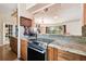 Modern kitchen featuring stainless steel appliances, granite countertops, and tiled backsplash at 422 Dunedin Cir, Temple Terrace, FL 33617