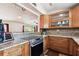 The kitchen has stainless steel appliances, sleek cabinetry, and granite countertops at 422 Dunedin Cir, Temple Terrace, FL 33617