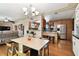 Open-concept kitchen with stainless steel appliances and light wood cabinets connected to the dining area at 422 Dunedin Cir, Temple Terrace, FL 33617