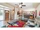 Inviting living room with exposed brick, hardwood floors, open to the bar, and comfortable seating at 422 Dunedin Cir, Temple Terrace, FL 33617