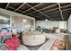 Covered patio with an inflatable hot tub and outdoor furniture, creating a versatile space for relaxation and gatherings at 422 Dunedin Cir, Temple Terrace, FL 33617