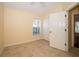 Inviting bedroom with tiled floor, featuring a window and closet at 4235 Angelica Loop, Wesley Chapel, FL 33543