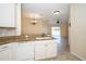 Open kitchen area with granite countertops and a view of the dining and living areas at 4235 Angelica Loop, Wesley Chapel, FL 33543