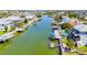 Aerial view of neighborhood, canals, and homes near the water with boat docks at 4275 Bellaire Dr, Hernando Beach, FL 34607