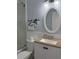 Cozy bathroom with a stylish vanity, decorative mirror, and a convenient glass-enclosed shower at 4275 Bellaire Dr, Hernando Beach, FL 34607