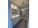 Bathroom featuring a glass enclosed shower, updated fixtures, and modern vanity at 4275 Bellaire Dr, Hernando Beach, FL 34607