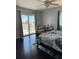 Bright bedroom featuring access to a private balcony and a view of the backyard canal at 4275 Bellaire Dr, Hernando Beach, FL 34607