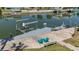 Waterfront home with a boat dock, lift, and outdoor seating for enjoying the views at 4275 Bellaire Dr, Hernando Beach, FL 34607