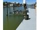 Dock with a boat lift, offering convenient water access and ease for boating enthusiasts at 4275 Bellaire Dr, Hernando Beach, FL 34607
