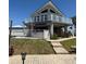 Two-story house with beautiful landscaping and a spacious balcony, perfect for outdoor living and relaxation at 4275 Bellaire Dr, Hernando Beach, FL 34607